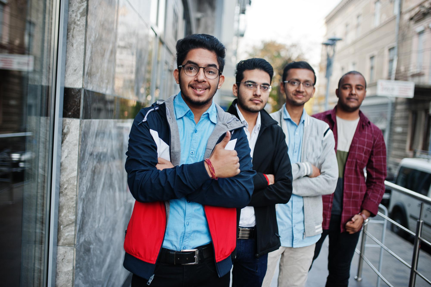 group four indian teen male students classmates spend time together